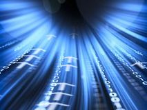 A close-up of a filing cabinet filled with various coloured folders and documents.