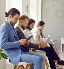 A hand placing a puzzle piece with a padlock symbol on a circuit board background.